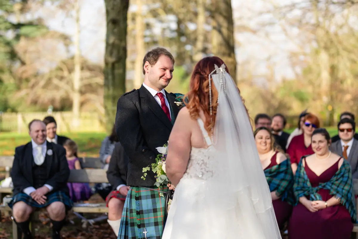 Bride and groom exchange vows at their Garden house venue wedding.