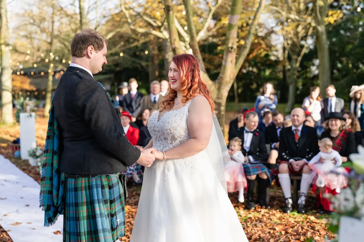 Bride and groom exchange vows at their Garden house venue wedding.