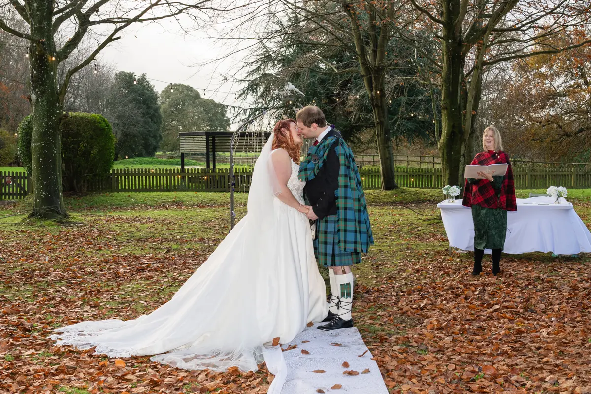 Bride and groom first kiss after their Garden House Venue wedding ceremony.