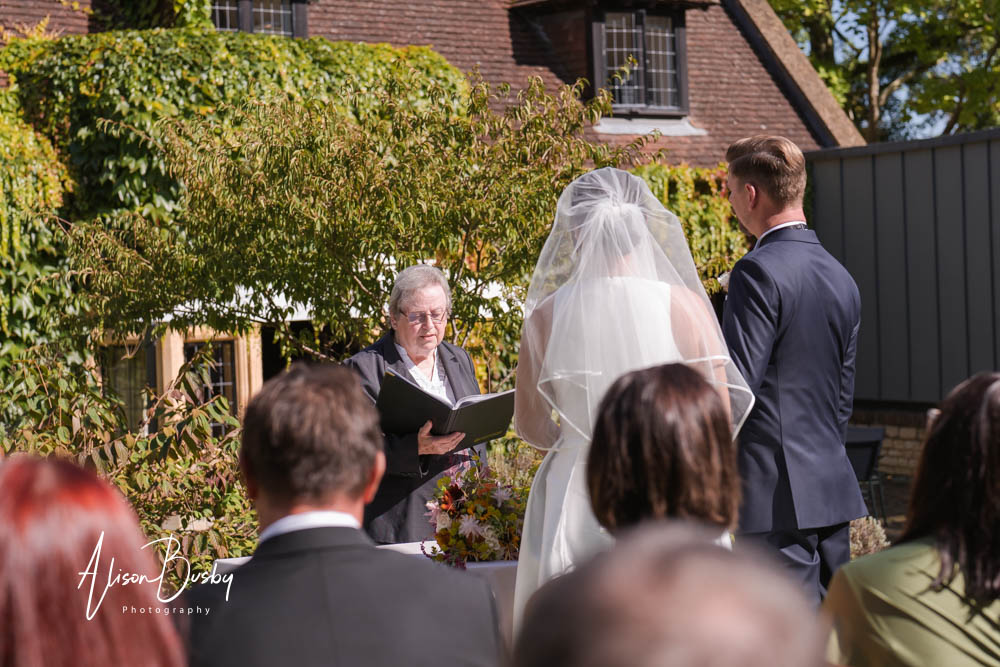 Natural wedding photography at Le Manoir aux Quat'Saisons in Oxfordshire. Outdoor wedding ceremony at La Belle Époque