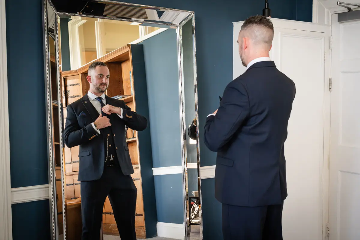 Groom prep at Farnham Castle wedding.