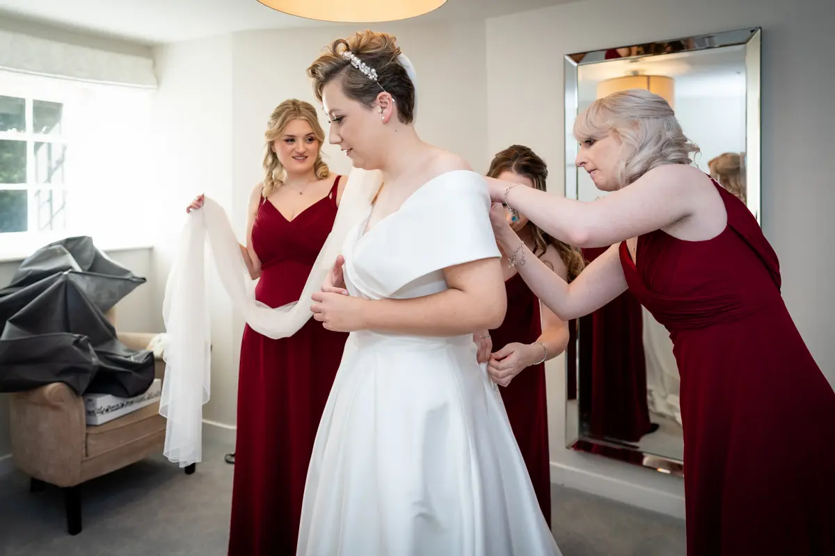 Bride getting ready at Farnham Castle wedding.