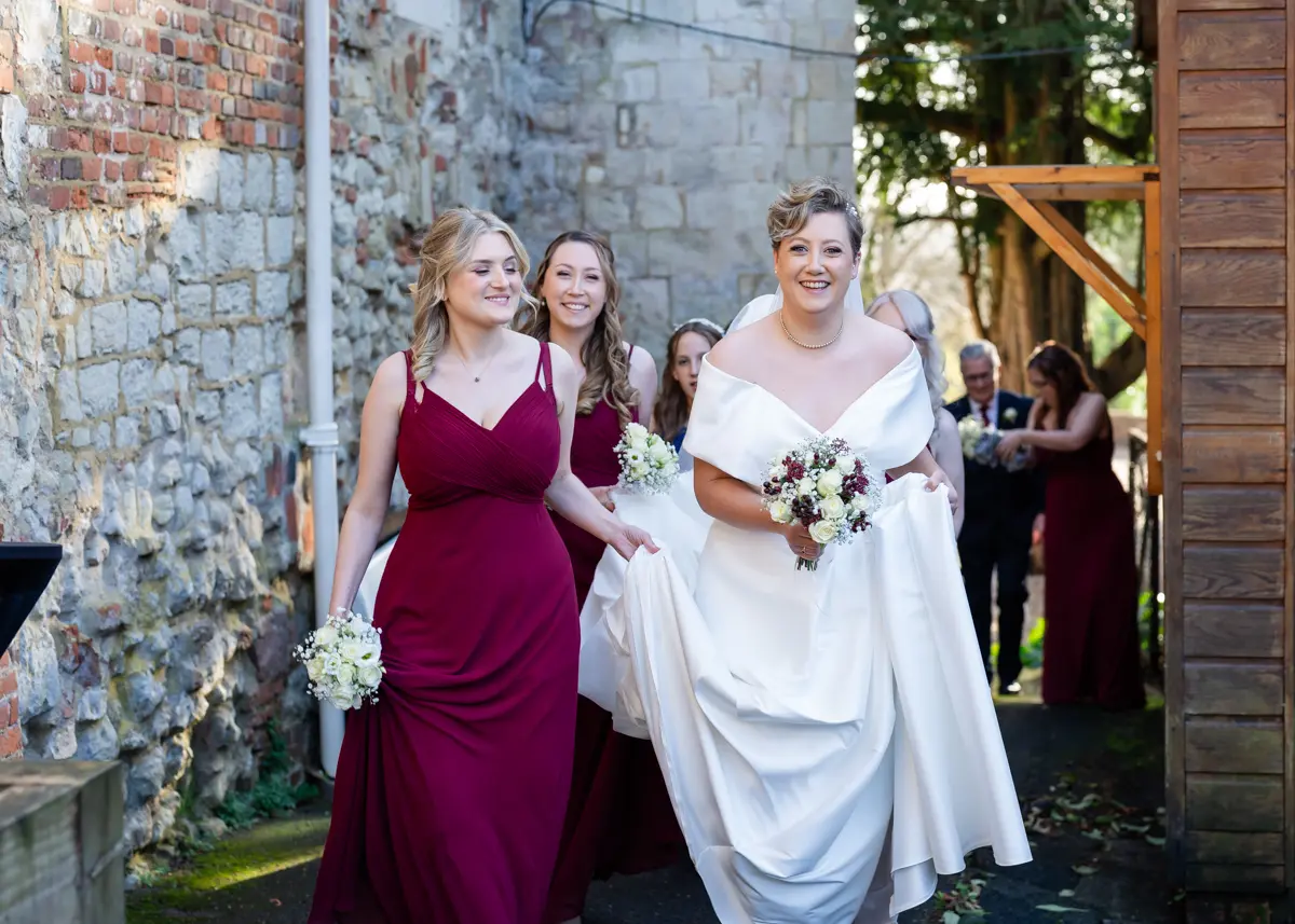 Bridal party enroute to ceremony at Farnham Castle wedding.