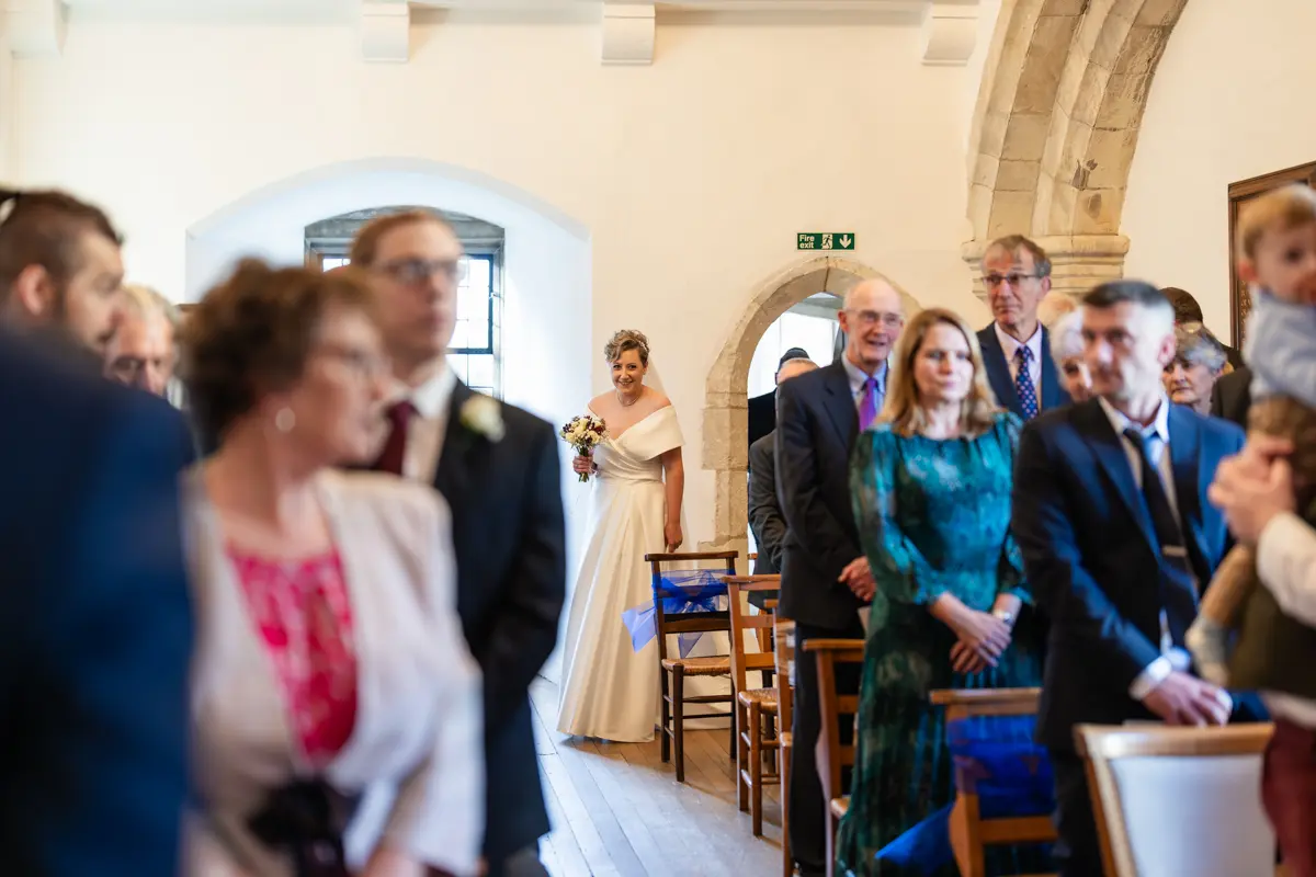 Bride arrives for ceremony at Farnham Castle wedding.