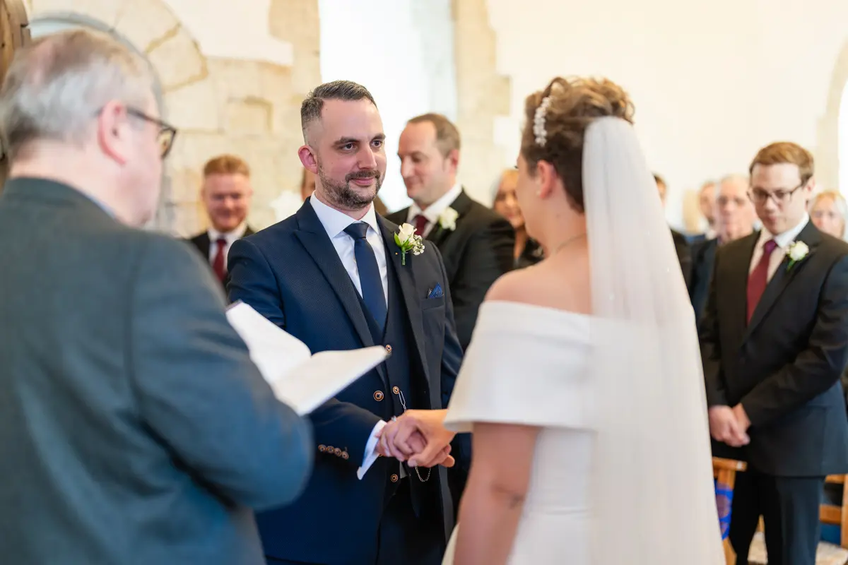 Wedding vows at Farnham Castle wedding.