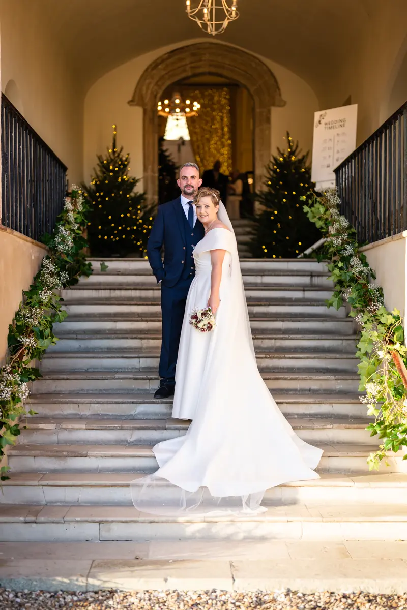 Bride and groom on Fox's Steps at their Farnham Castle wedding.