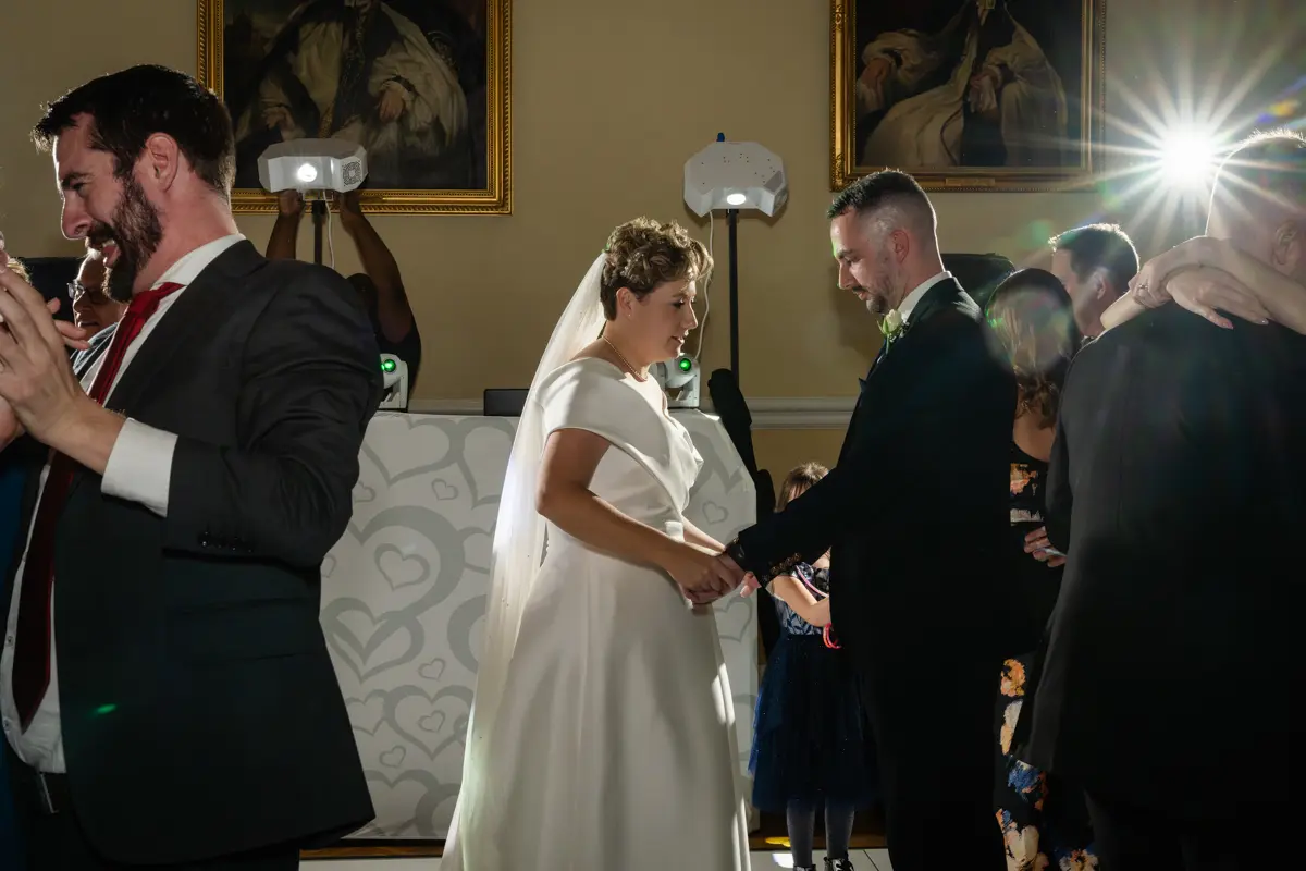 bride and groom dancing in the great hall at a Farnham Castle wedding.