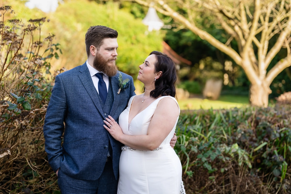 Bride and groom portrait in gardens. Hunton Park wedding photographer.