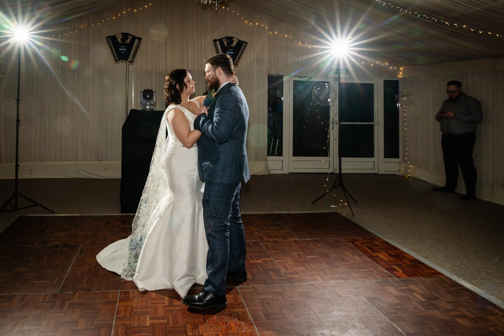 Bride and groom first dance in marquee. Hunton Park wedding photographer.