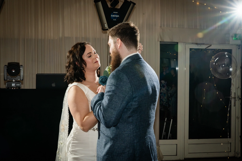 Bride and groom first dance in the marquee. Hunton Park wedding photographer.