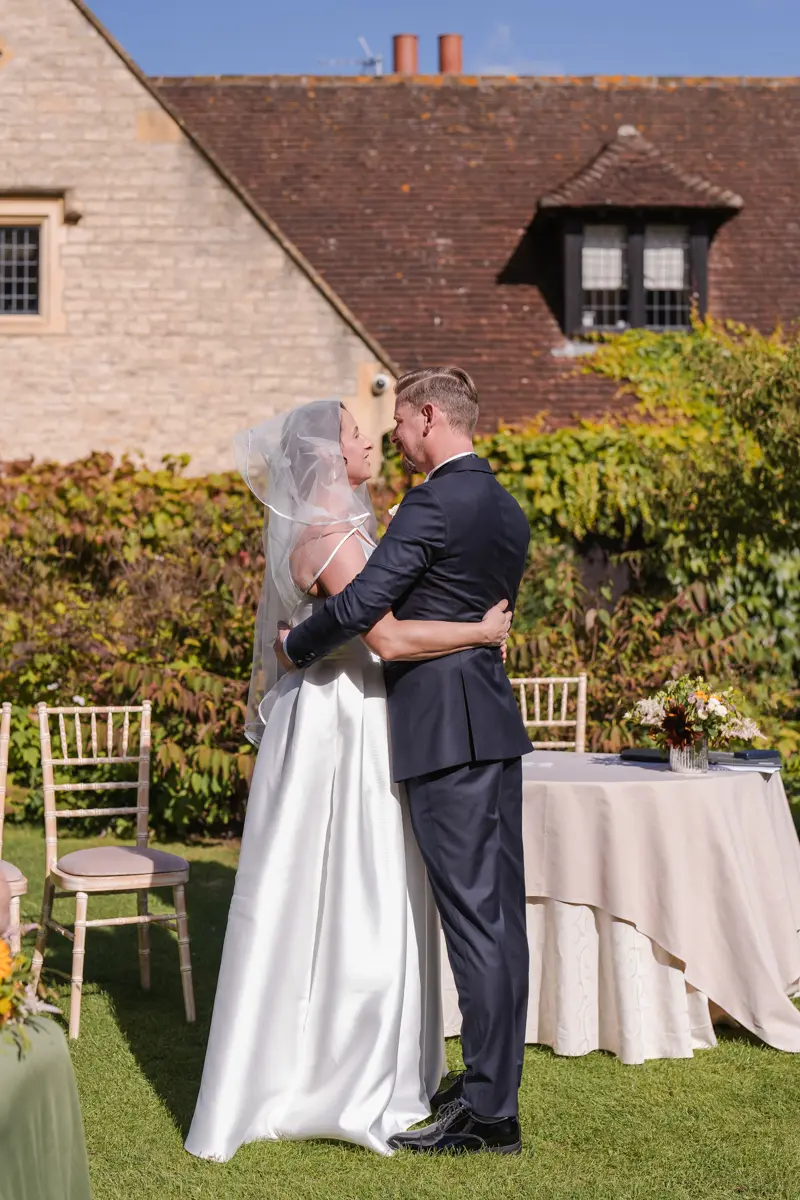 Bride and groom first embrace at their Le Manoir wedding in September. la belle epoque outdoor wedding ceremony.