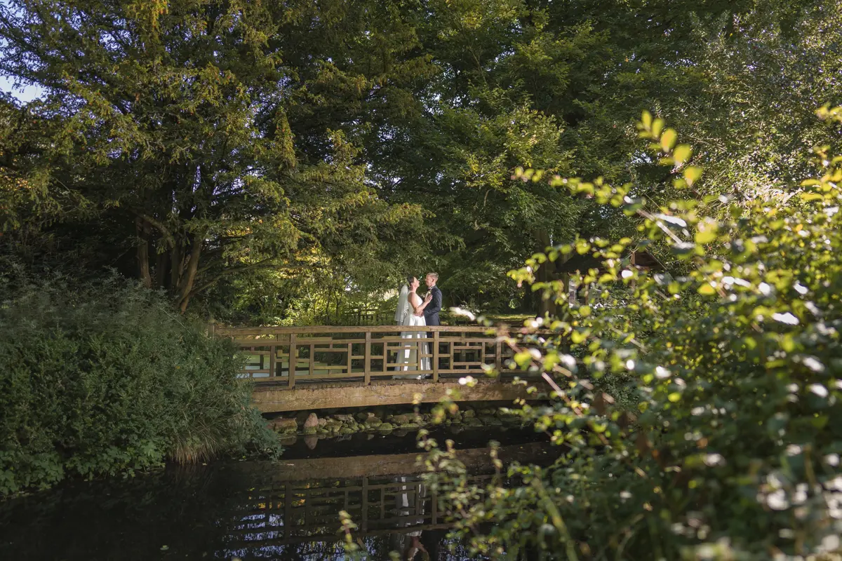 Bride and groom in Japanese tea garden at their Le Manoir wedding in September.