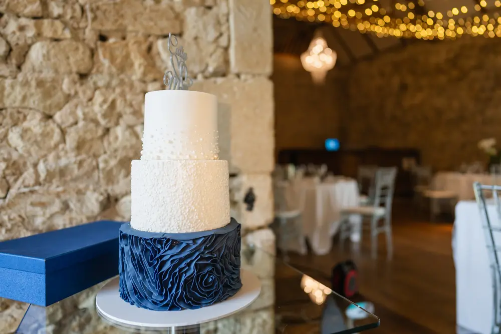 Notley Abbey Wedding photography. Wedding cake in monk's refectory.