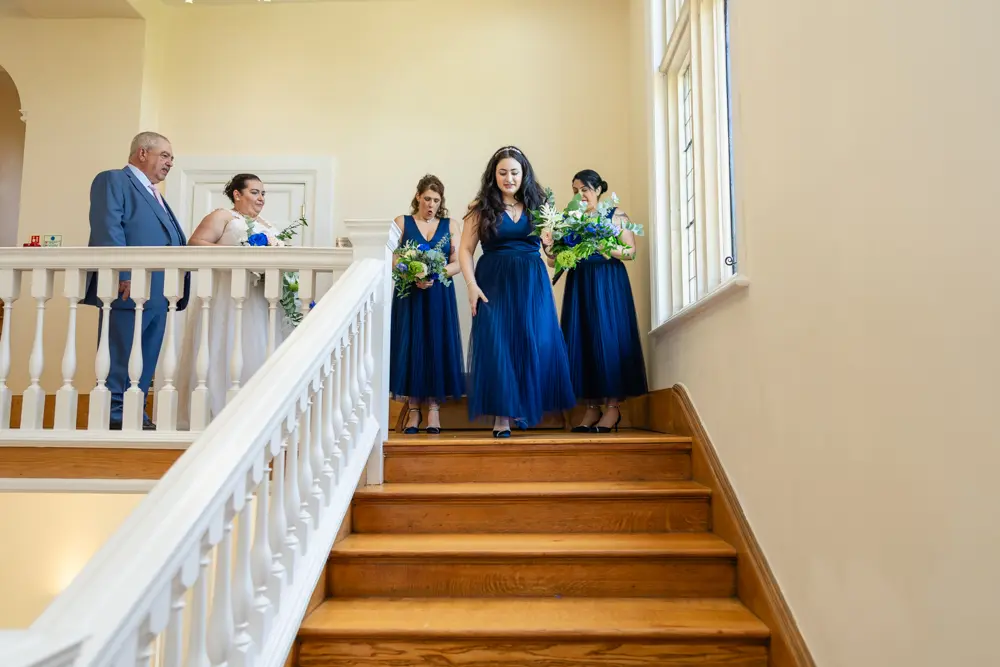 Notley Abbey Wedding photographer. Bridal party leaving for ceremony.