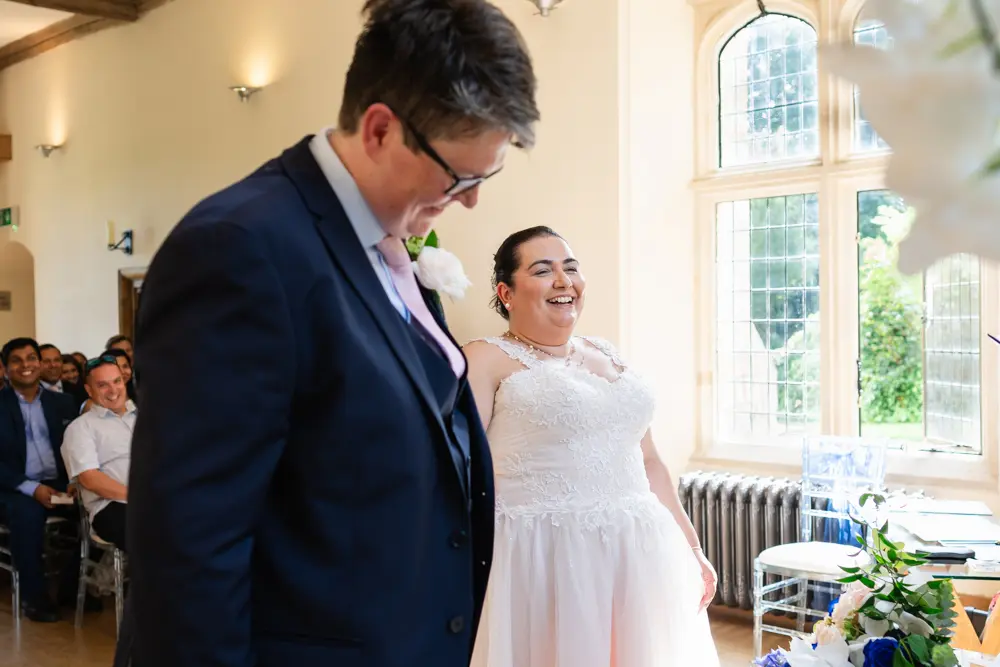 Notley Abbey Wedding photographer. Bride and groom during ceremony.