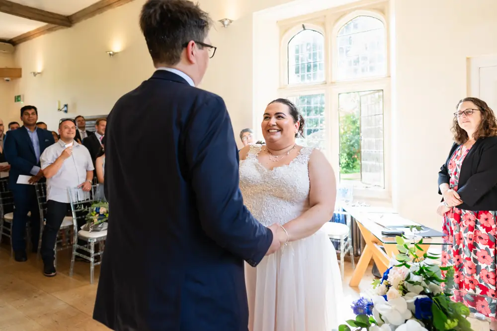 Notley Abbey Wedding photographer. Bride and groom during ceremony.