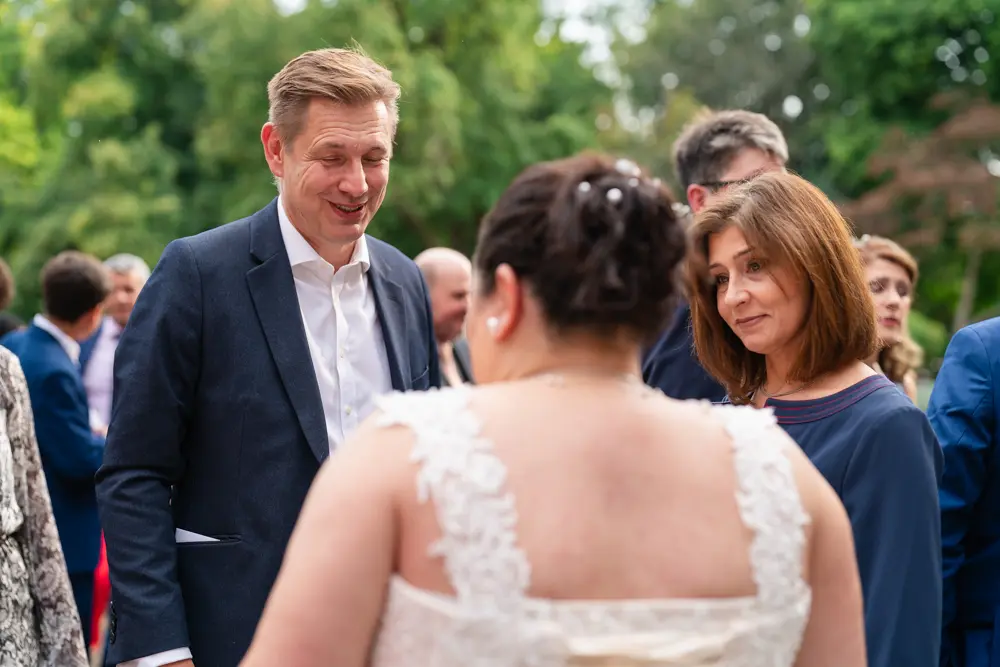 Notley Abbey Wedding photographer. Bride with guests.