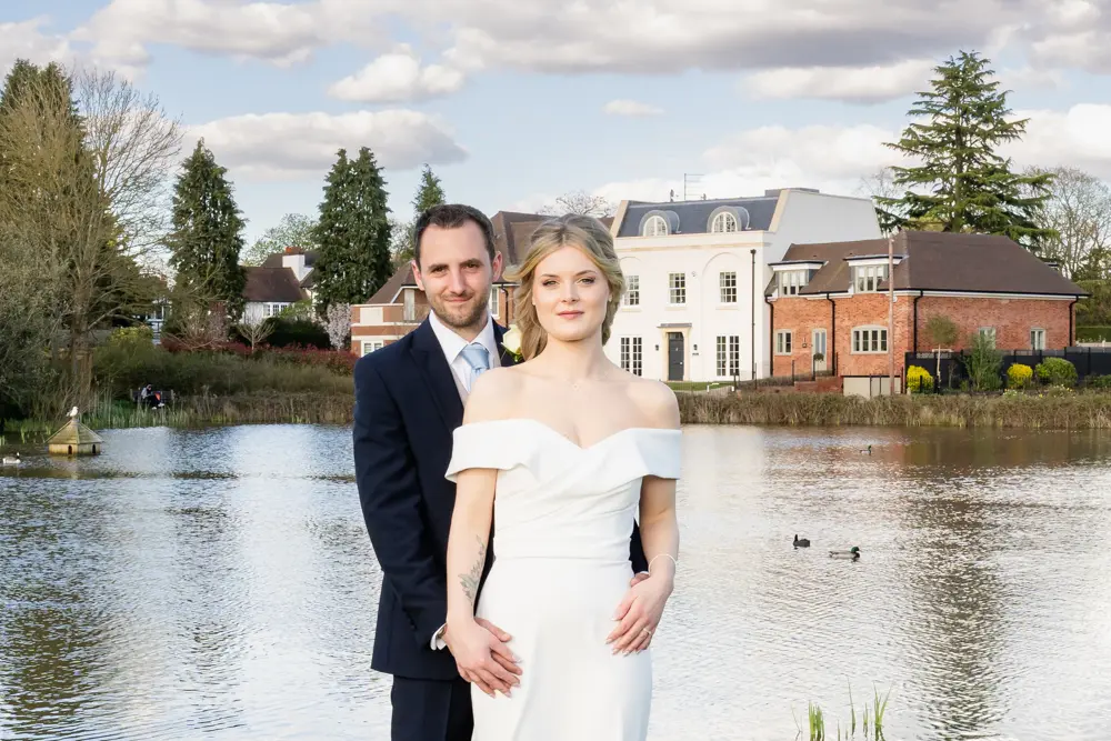 Bull Hotel wedding photography. Bride and groom next to Latchmoor Pond in Gerrards Cross.