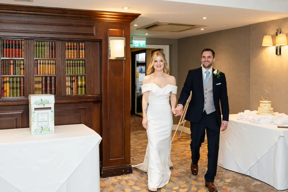 Bull Hotel wedding photography. Bride and groom arriving for wedding breakfast.