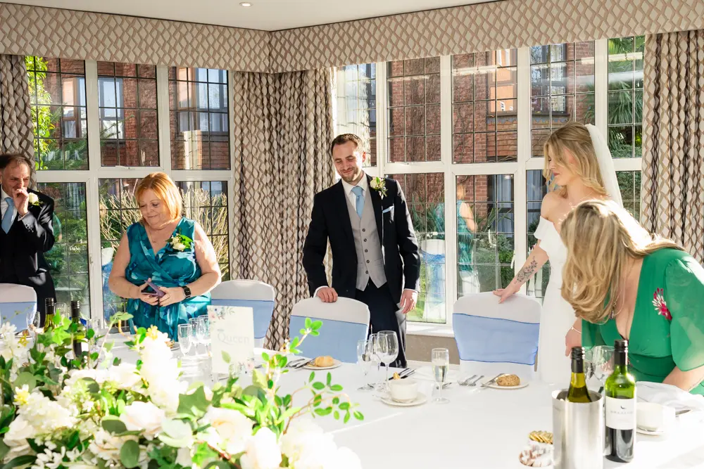 Bull Hotel wedding photography. Bride and groom arriving for wedding breakfast.