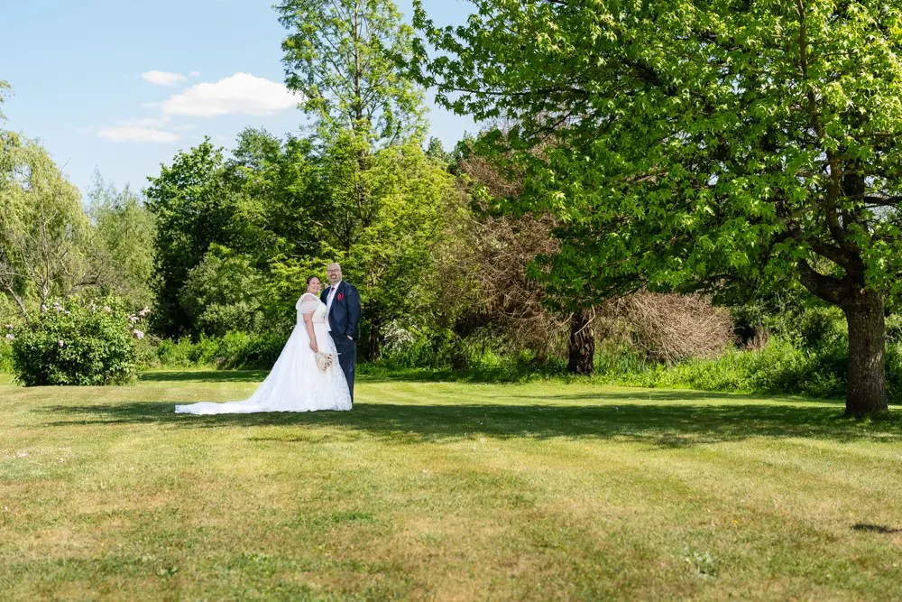 The Old Mill Wedding Photography. Bride and groom in grounds.