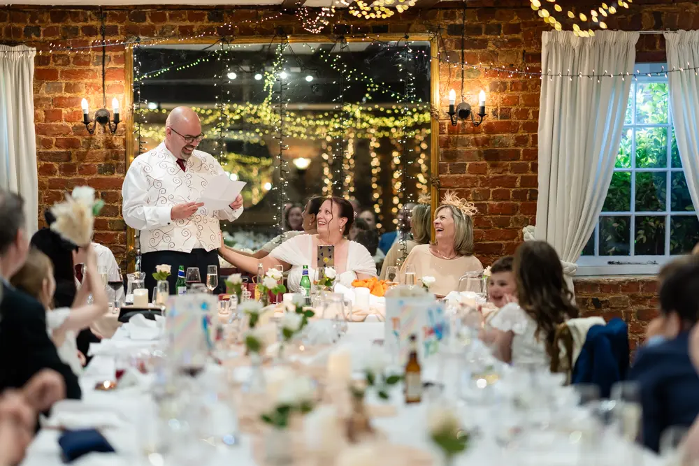 The Old Mill Wedding Photographer. Groom's speech inside mill.