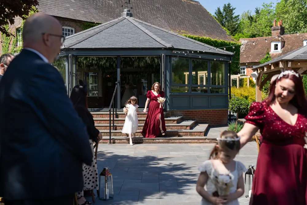 The Old Mill Wedding Photography. Bridesmaids arriving for ceremony.