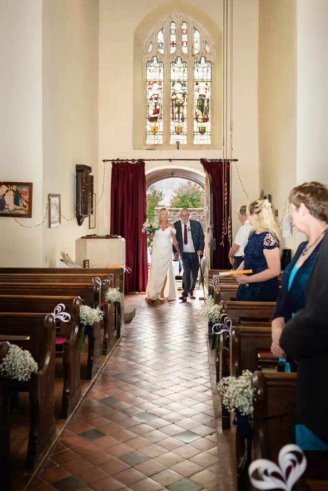 St Boltoph Bradenham wedding photography. Bride arriving for ceremony.