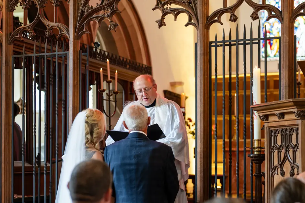 St Boltoph Bradenham wedding photography. Bride and groom during wedding ceremony.