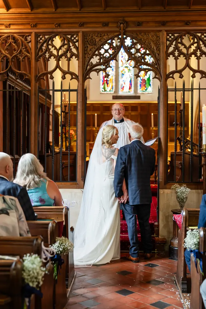 St Boltoph Bradenham wedding photography. Bride and groom during wedding ceremony.