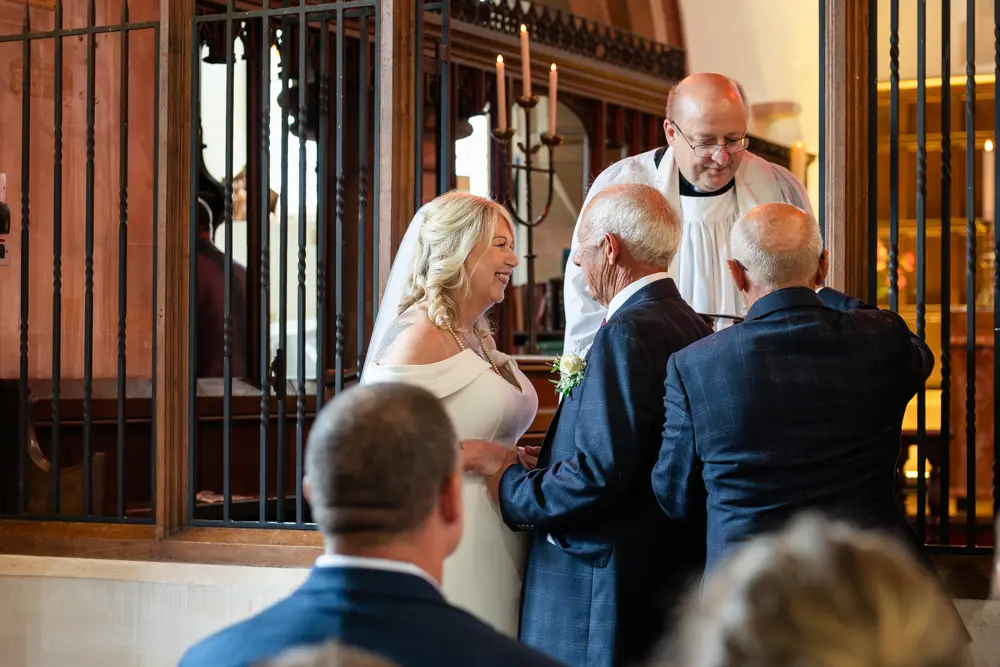 St Boltoph Bradenham wedding photography. Bride and groom during wedding ceremony.
