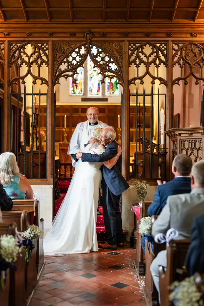 St Boltoph Bradenham wedding photography. Bride and groom during wedding ceremony.