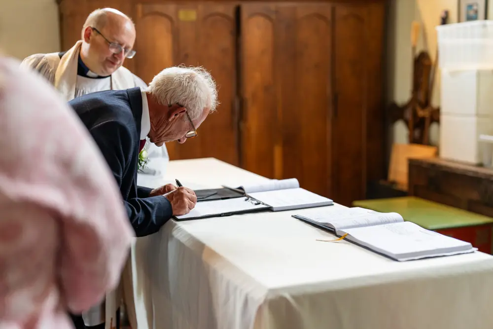 St Boltoph Bradenham wedding photography. Bride and groom during wedding ceremony.