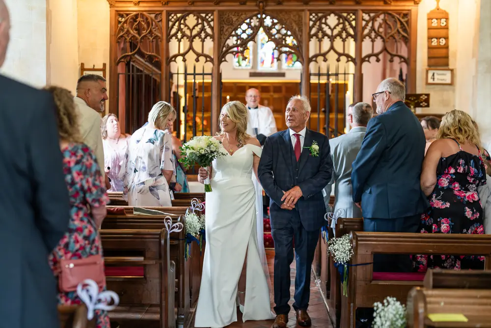 St Boltoph Bradenham wedding photography. Bride and groom leaving church ceremony.