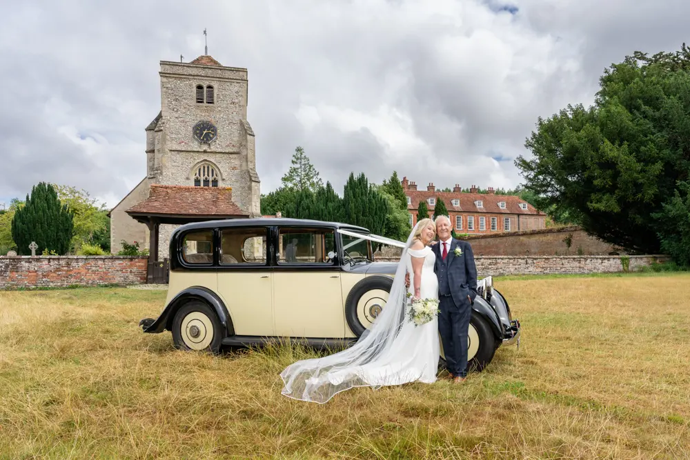 St Boltoph Bradenham Wedding Photography St Boltoph Bradenham wedding photography. Bride and groom in front of church with vintage Rolls Royce wedding car.