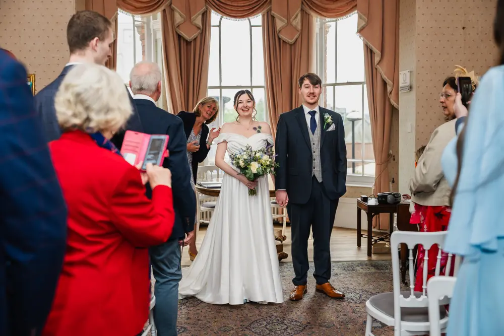 Bride and groom leaving their wedding at Judges Lodgings Aylesbury.