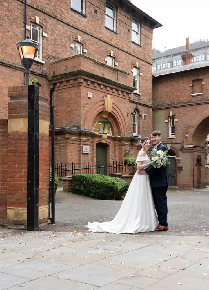 Bride and groom outside the Judges Lodgings in Aylesbury after their wedding.