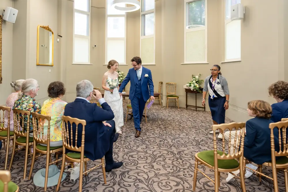 Bride and groom leaving ceremony. Reading Town Hall Wedding photographer