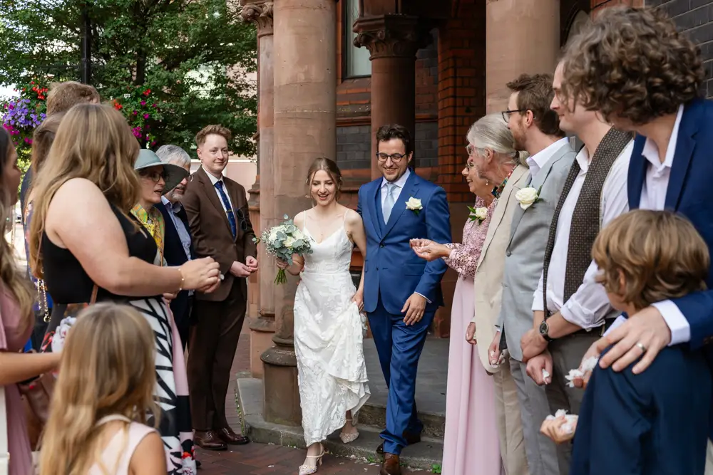 Bride and groom in confetti. Reading Town Hall Wedding photographer