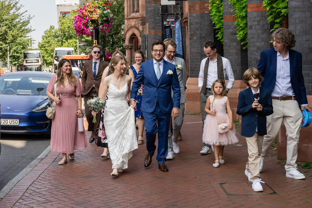 Bride and groom procession from Town Hall Reading. Wedding photographer