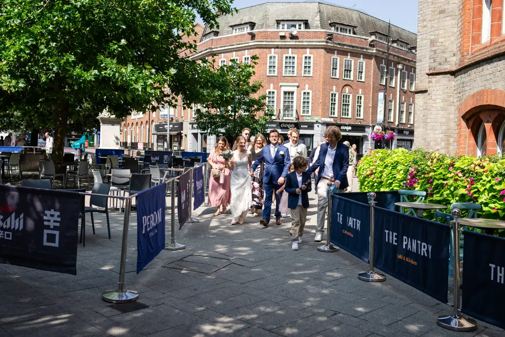 Bride and groom procession from Town Hall Reading. Wedding photographer