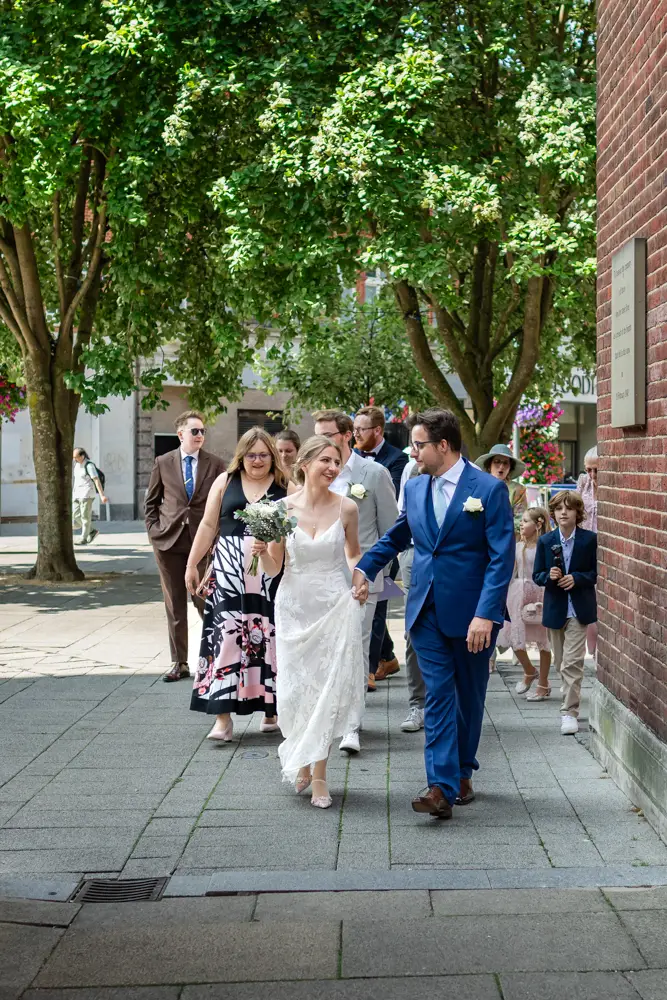 Bride and groom procession from Town Hall Reading. Wedding photographer
