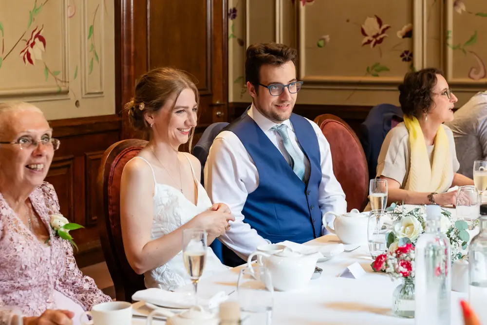 Guests chat at wedding breakfast. Roseate wedding photographer in Reading.