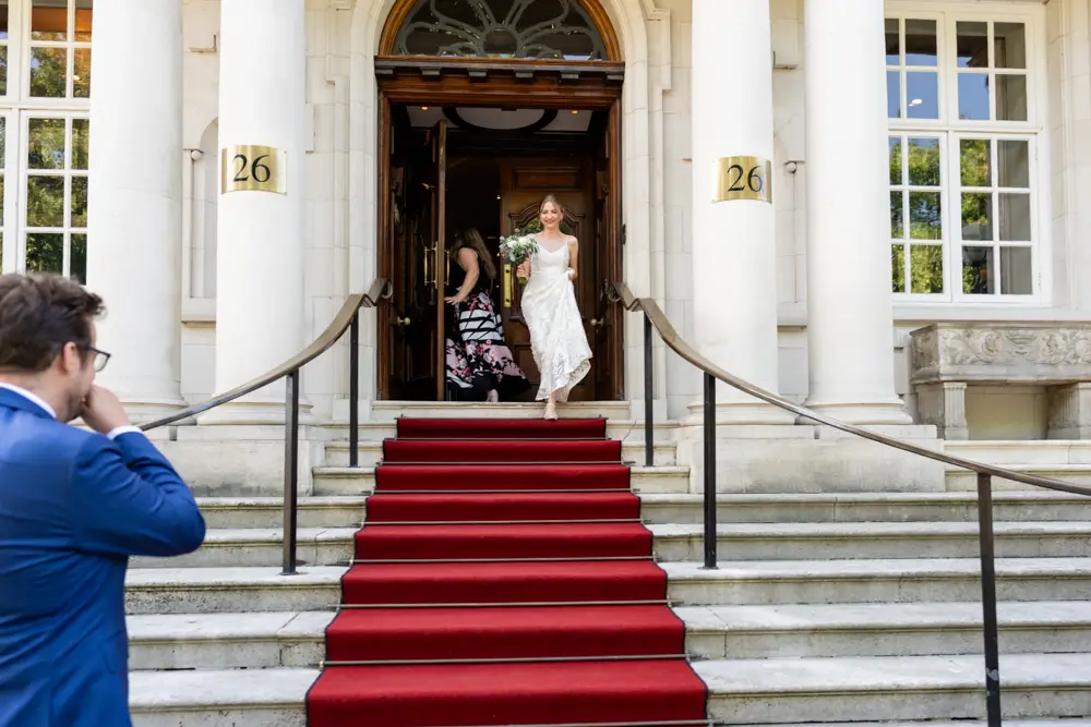 bride and groom on hotel steps. Roseate wedding photographer in Reading.