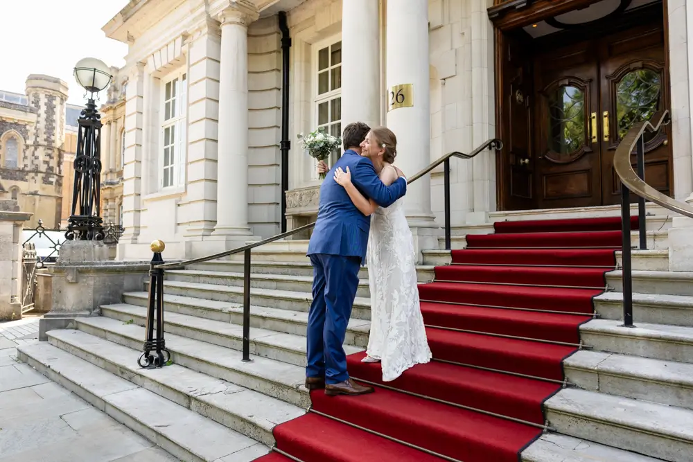 bride and groom on hotel steps. Roseate wedding photographer in Reading.