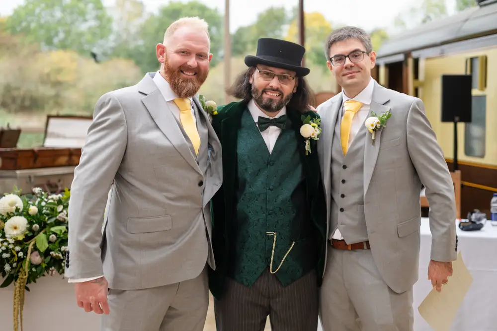 Buckinghamshire Railway Centre Wedding Photographer. Broom with groomsmen inside main building