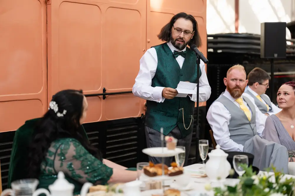 Buckinghamshire Railway Centre Wedding Photographer. groom speech in main hall.