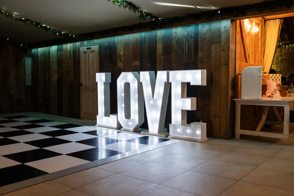 Notley Tythe Barn Wedding Photography. Love sign