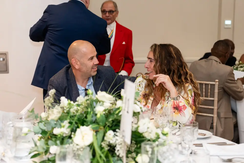 Stoke Place wedding photographer. guests at table.