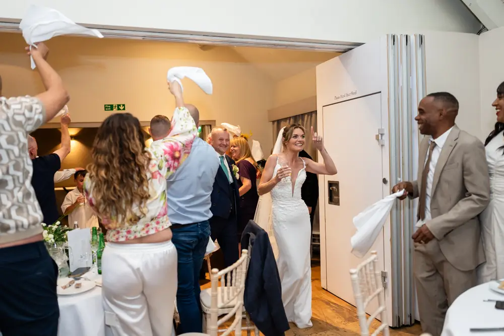 Stoke Place wedding photographer. Bride and groom arriving for wedding breakfast.